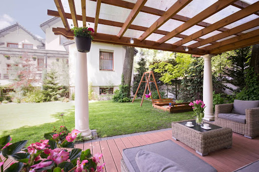 pergola patio with a cover in a sunny backyard
