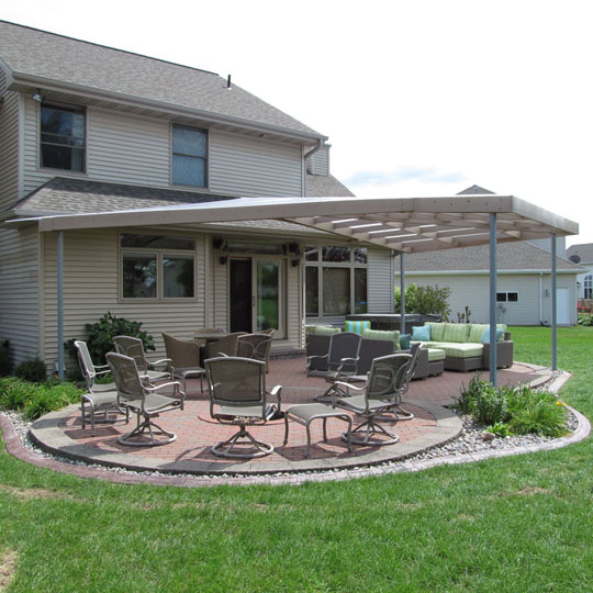 Large outdoor living space in Orlando, FL with plastic pergola cover