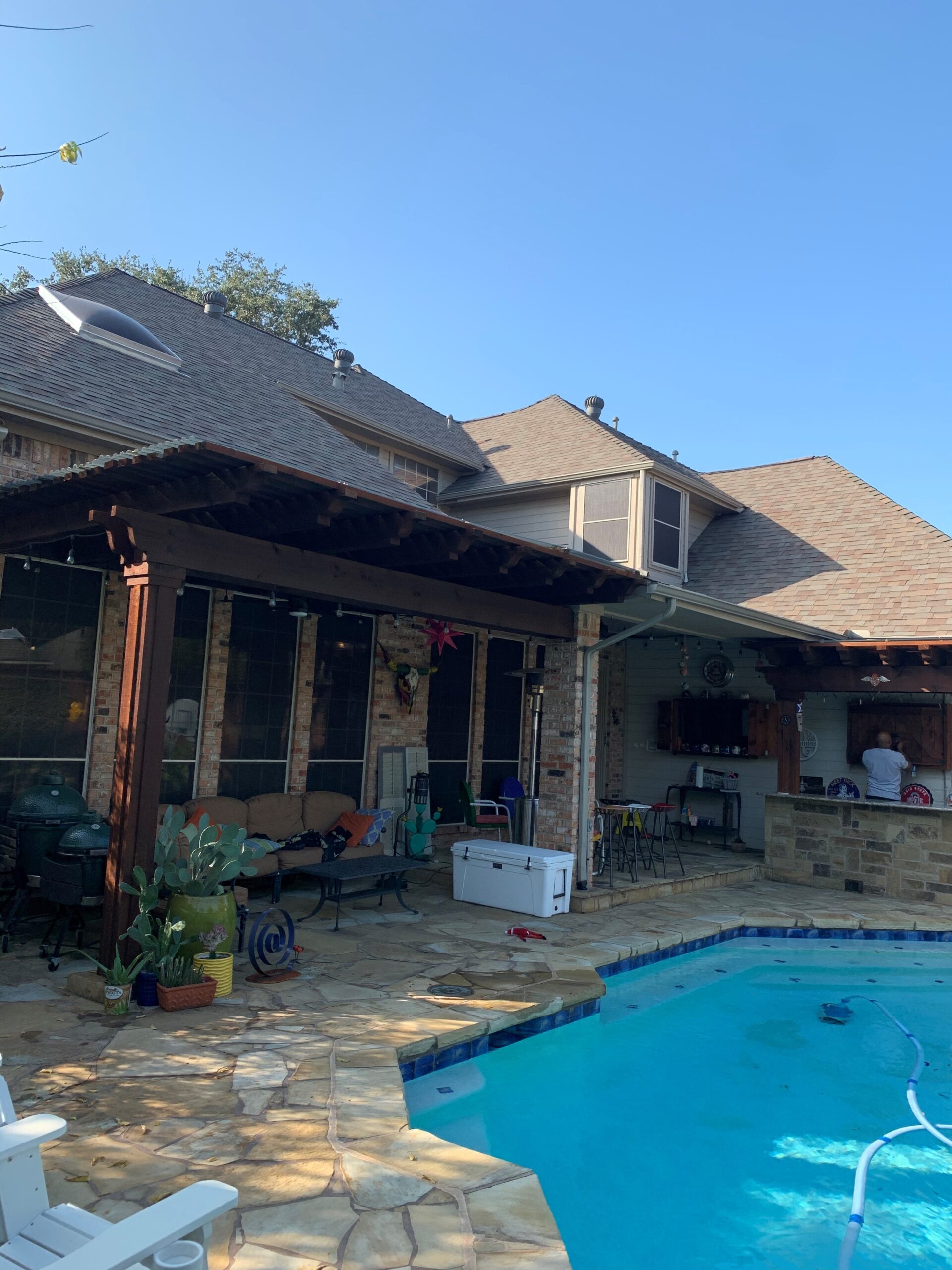 Residential pool area in Tampa-Clearwater, FL with a covered pergola